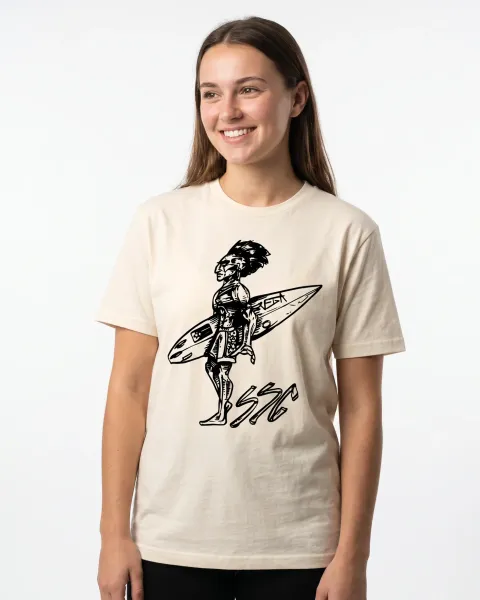 Woman wearing a natural shirt with a black ink drawing of a surfer carrying a board